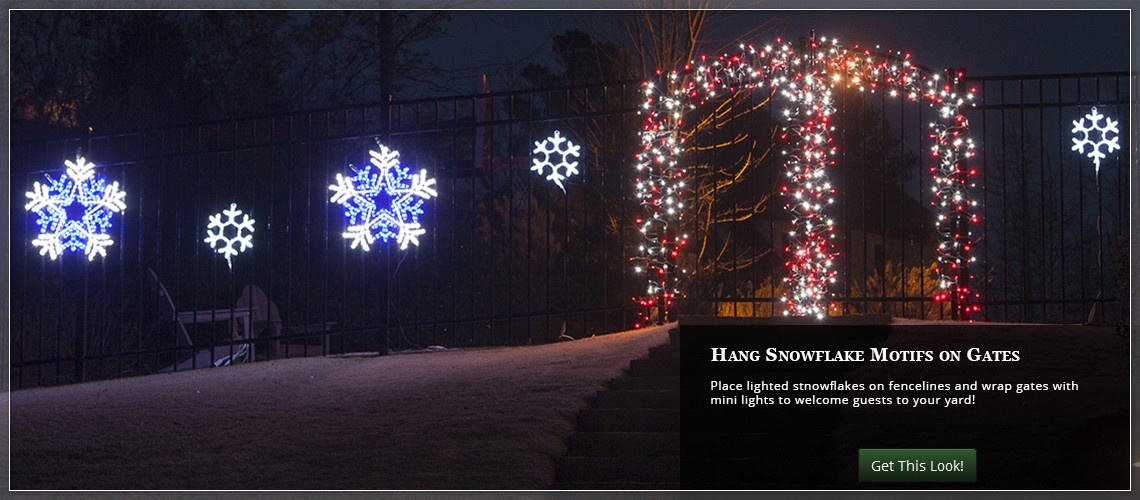 Add lighted snowflakes along the fence to liven up your Christmas yard decorations.