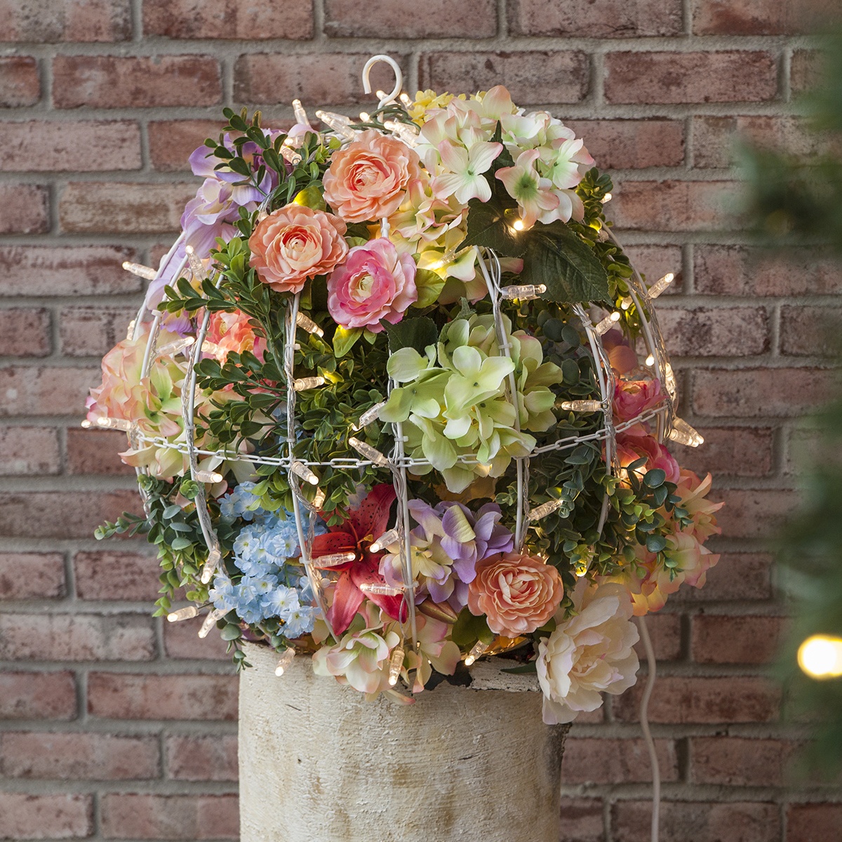Use a bounty of bright flowers in place of Christmas accents to create a light ball bursting with the fresh colors and textures of spring!
